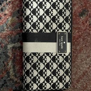 Beautiful black and white Kate Spade wallet with hot pink interior